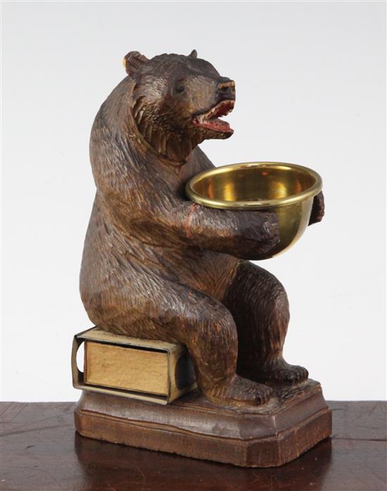 A Black Forest carved bear match tidy, 5.5in.